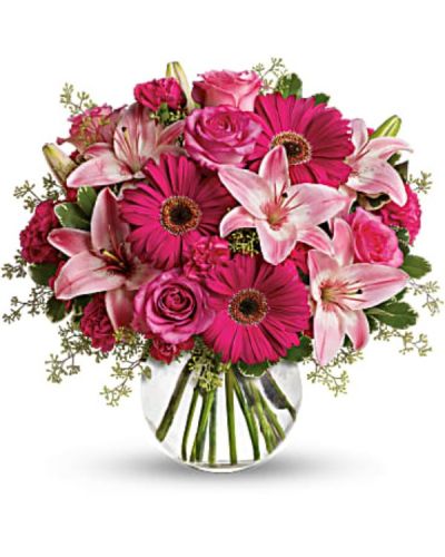 Sometimes all you need is a little pink me up! An ideal pick for anyone whose favorite color is pink, this stylish mix is full of variety and comes presented in a clear glass bubble bowl they'll use again and again.
A wide variety of flowers including pink roses, pink asiatic lilies, hot pink gerberas, pink carnations and hot pink miniature carnations are mixed with fresh variegated pittosporum and seeded eucalyptus.