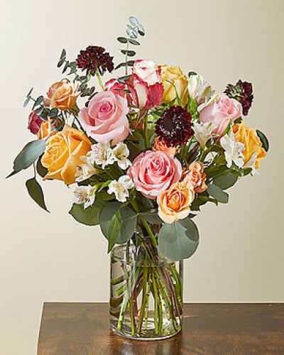 <h5>Fall in love with fresh flowers again with the Sweet Bramble Bouquet. Enjoy the timeless rose in colors like peach and pink and unique varieties like sweetness roses and isle spray roses. The baby blue and silver dollar eucalyptus add a soft touch of green against the burgundy scabiosa.</h5>