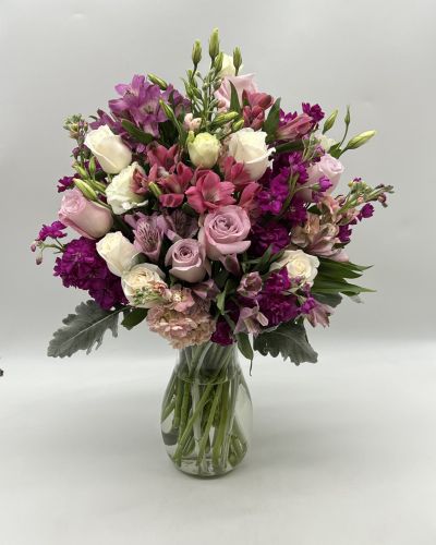 <p>This beautiful bouquet features some gorgeous blooms that will brighten anyone's day with wonderful shades of purple!</p>