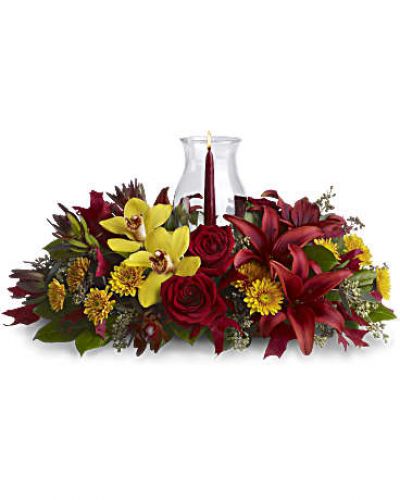 <div id="mark-3" class="m-pdp-tabs-marketing-description">Give thanks by sending this fall flower centerpiece. A chic, exotic spin on the traditional Thanksgiving centerpiece, it features orchids, roses, lilies and leucadendron in rich fall colors below a glowing taper candle, surrounded by a glass hurricane.</div>
<p>&nbsp;</p>
<div id="desc-3">
<ul>
<li>Yellow cymbidium orchids, red roses, burgundy asiatic lilies, bronze cushion mums, red leucadendron, seeded eucalyptus and salal are accented with red oak leaves.</li>
<li>A pomegranate taper candle inside a classic glass hurricane adds a warm glow to the room.</li>
</ul>
</div>