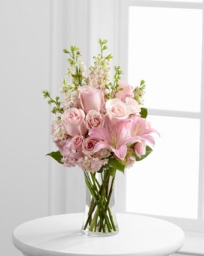<p>The FTD® Wishes & Blessings™ Bouquet is a stunning way to offer your condolences for their loss and commemorate the life of the deceased. Soft pink roses, spray roses, Oriental lilies, hydrangea and larkspur are brought together in a clear glass vase to create an eye-catching display of soft serenity.</p>