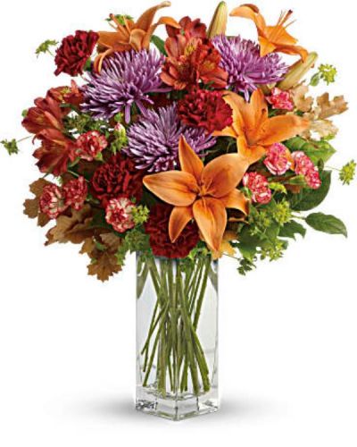 <div id="mark-3" class="m-pdp-tabs-marketing-description">Ring in the season with this fresh, colorful arrangement of lilies and alstroemeria. Hand-delivered in our beautifully crafted vase, it's an easy way to brighten anyone's day!</div>
<div id="desc-3">
<ul>
 	<li>This lovely bouquet includes orange asiatic lilies, dark orange alstroemeria, red carnations, orange miniature carnations, lavender disbud chrysanthemums, bupleurum, lemon leaf and oak leaves.</li>
</ul>
</div>