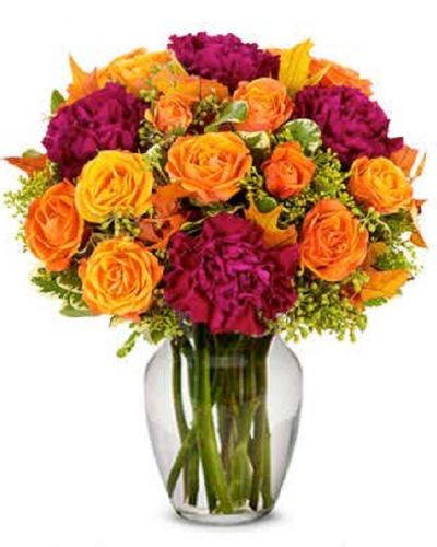 Enjoy this dazzling array of purple and orange guaranteed to brighten anyone's day. A gorgeous assortment of beautiful flowers carefully procured by our artisan designers, we hope that the smiles that we deliver daily helps you make everlasting memories.