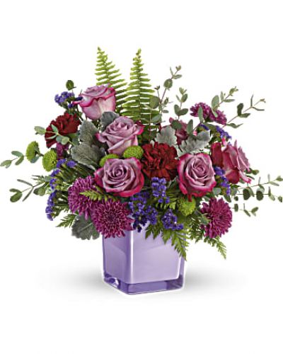 <div id="mark-3" class="m-pdp-tabs-marketing-description">A serene style statement in lush lavender roses and fresh maroon blooms, this rich bouquet in an amethyst-colored cube is a beautiful surprise for any occasion!</div>
<p>&nbsp;</p>
<div id="desc-3">
<ul>
<li>
<blockquote><p>Lavender roses, maroon carnations, purple cushion spray chrysanthemums, green button spray chrysanthemums, and purple sinuata statice are accented with sword fern, leatherleaf fern, dusty miller, and parvifolia eucalyptus.</p></blockquote>
</li>
</ul>
</div>